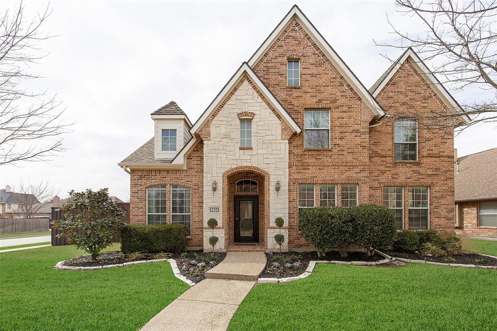12321 Alfa Romeo Way Frisco, TX 75033 - Photo 1 of 1 a front view of a house with a yard and trees