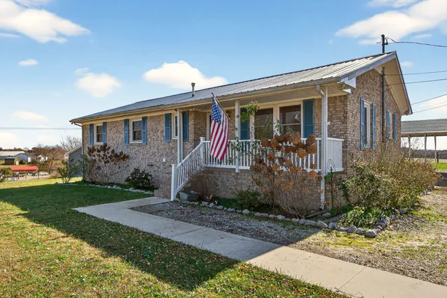 a front view of a house with garden