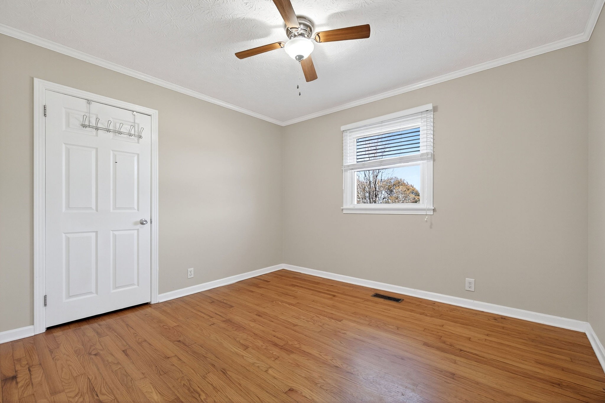 326 Webb Lane Smithville, TN 37166 - Photo 15 of 31 a view of empty room with wooden floor and fan