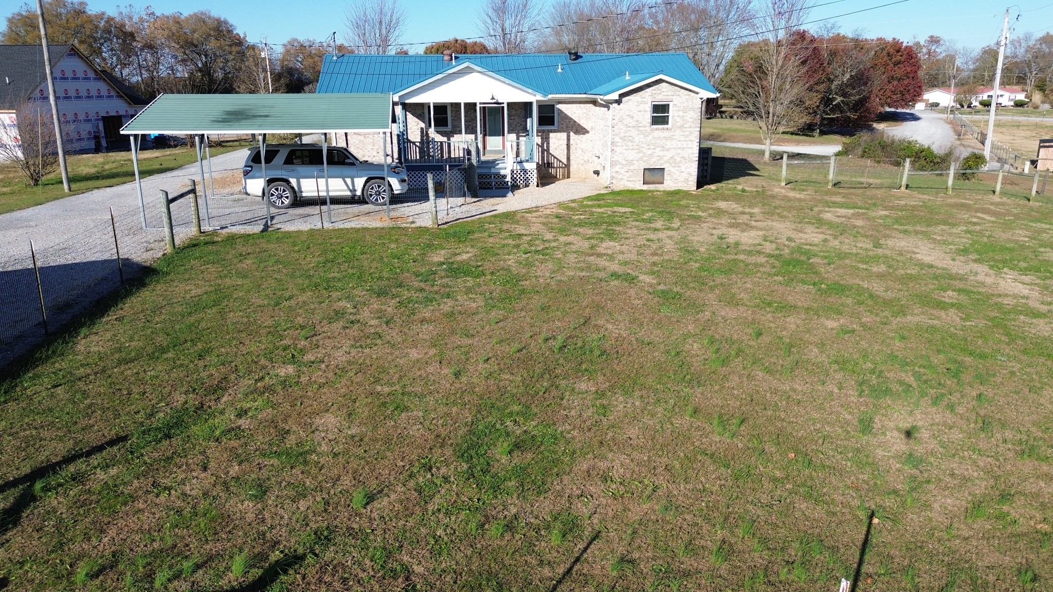 326 Webb Lane Smithville, TN 37166 - Photo 27 of 31 a front view of a house with a yard table and chairs