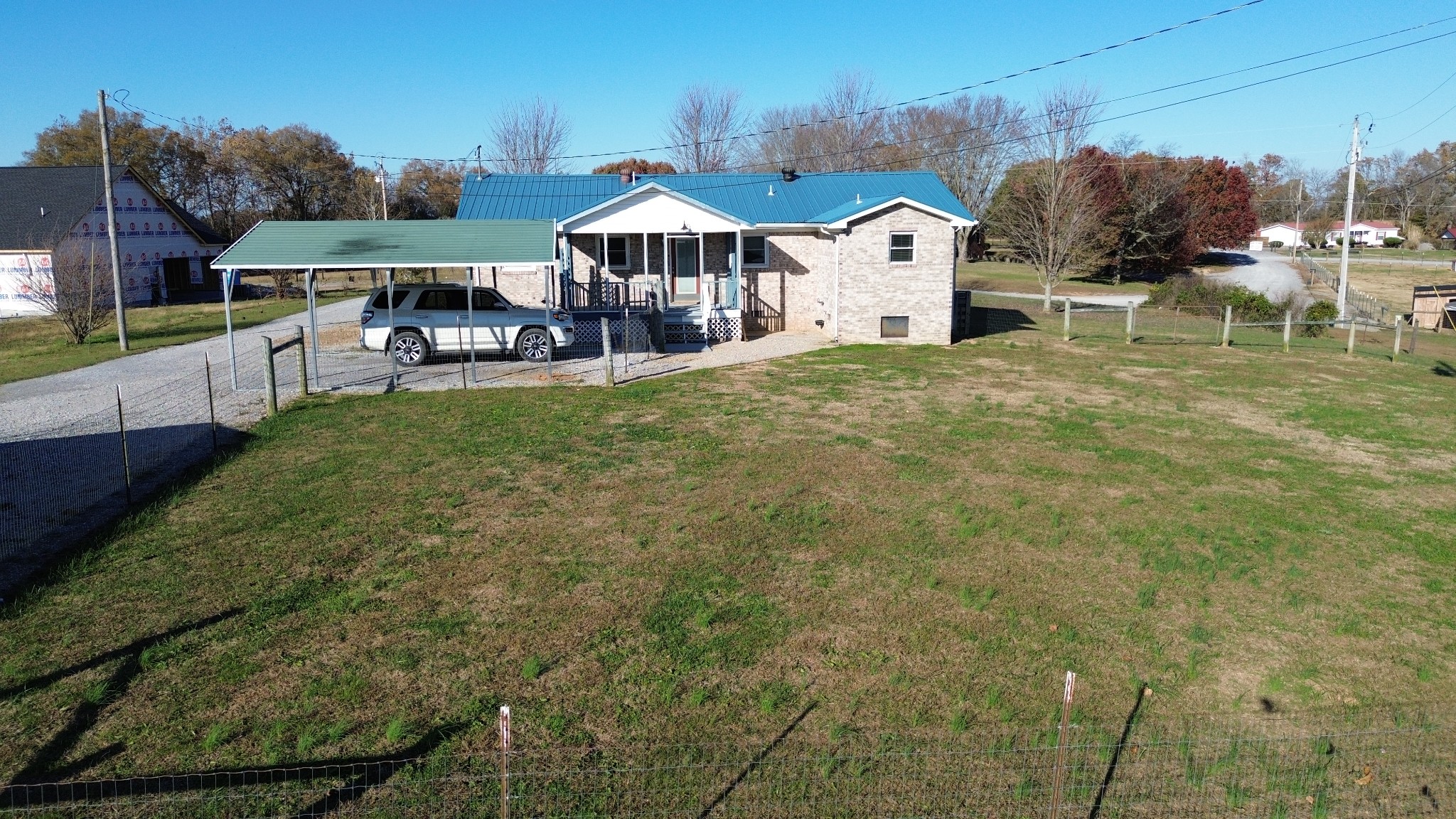 326 Webb Lane Smithville, TN 37166 - Photo 29 of 31 a view of a house with a yard and sitting area