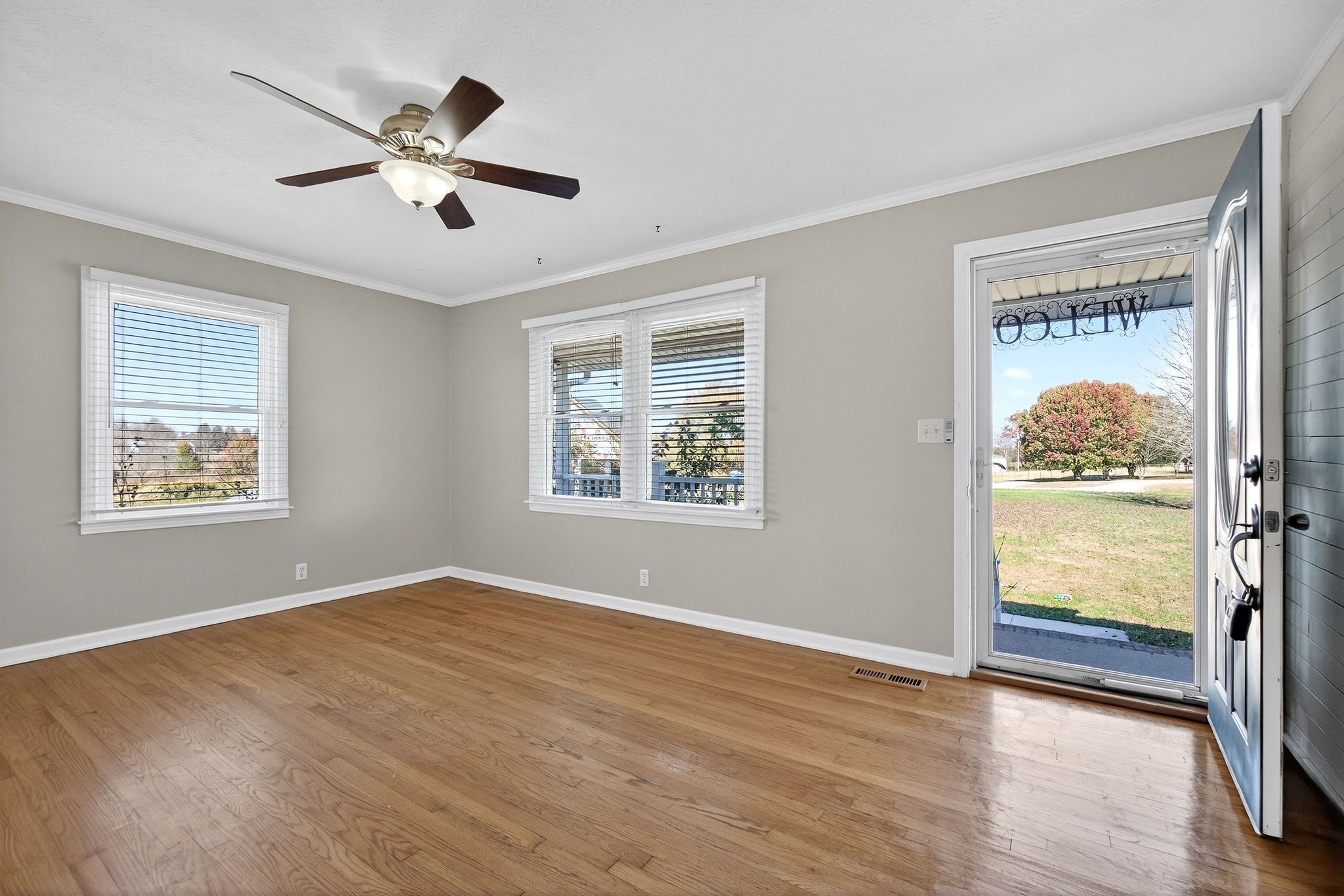 326 Webb Lane Smithville, TN 37166 - Photo 3 of 31 a view of an empty room with wooden floor and a window