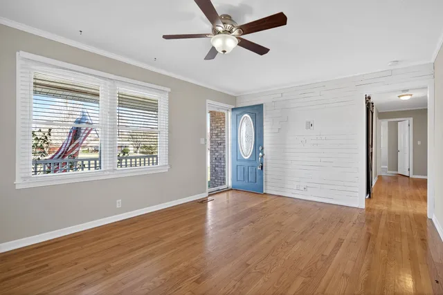 a kitchen with stainless steel appliances granite countertop a refrigerator a stove a sink and a microwave