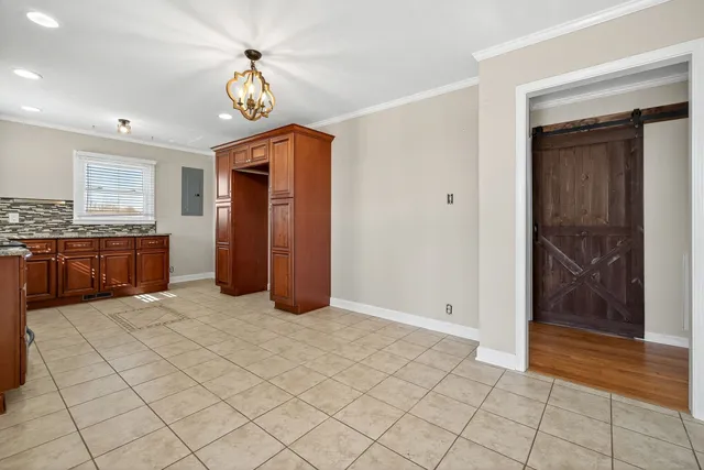 a kitchen with stainless steel appliances granite countertop a stove microwave and oven