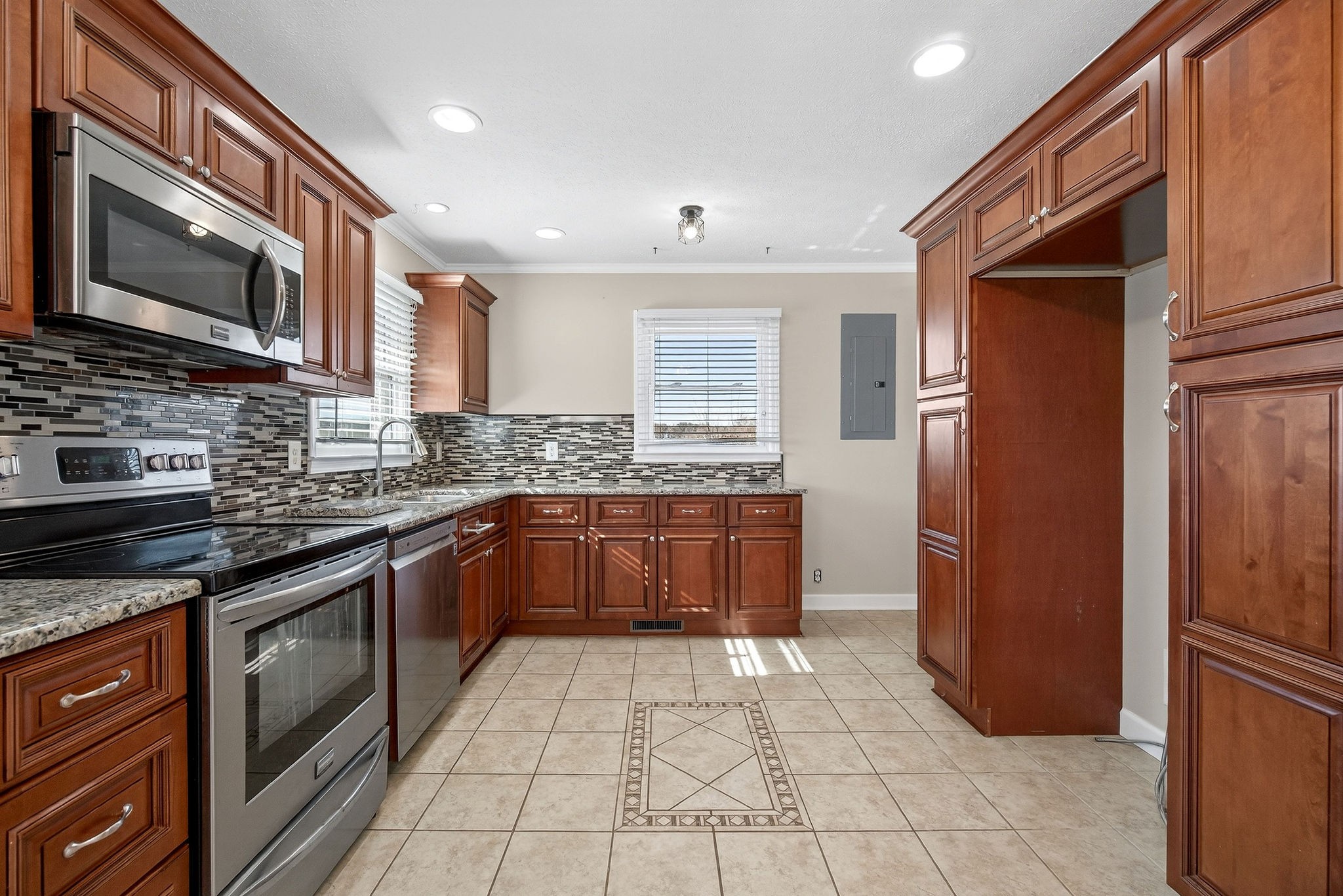 326 Webb Lane Smithville, TN 37166 - Photo 6 of 31 a kitchen with stainless steel appliances granite countertop a refrigerator a stove a sink and a microwave