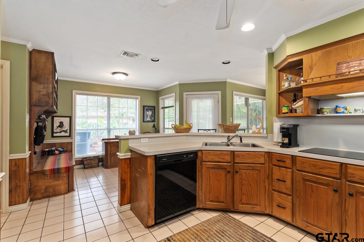 1113 Lonnie Drive Athens, TX 75751 - Photo 15 of 32 a kitchen with a sink stove and cabinets