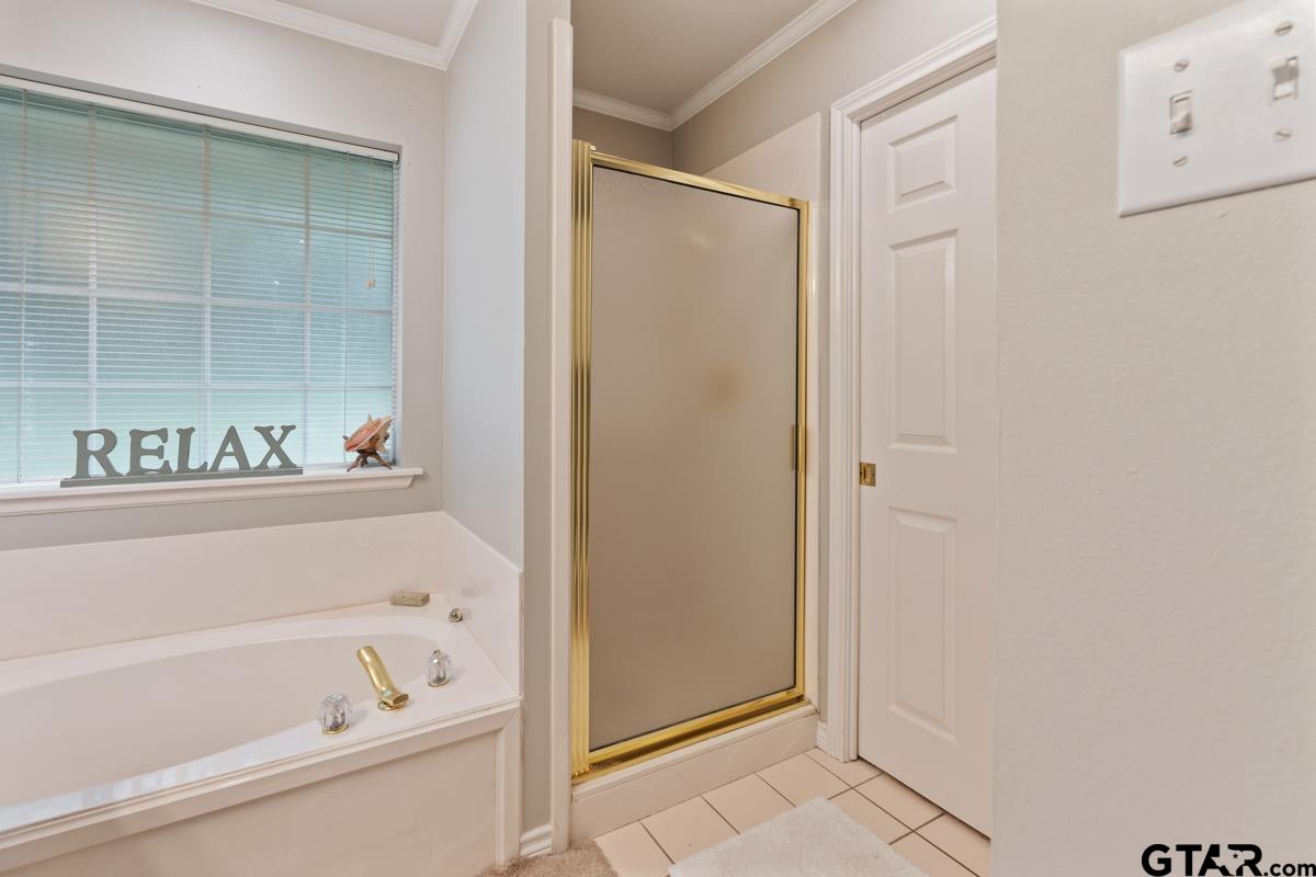 1113 Lonnie Drive Athens, TX 75751 - Photo 22 of 32 a bathroom with a bathtub and a shower