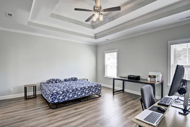 a bedroom with furniture and a window
