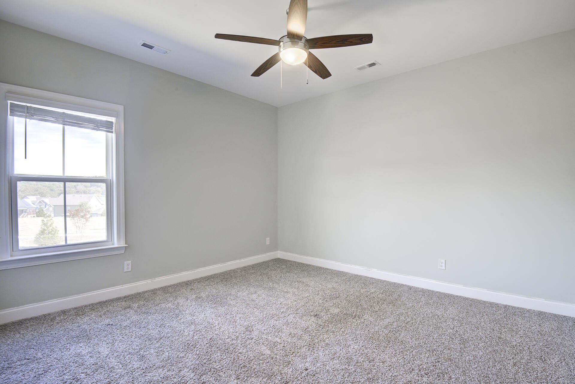 3625 Weathervane Loop Apison, TN 37302 - Photo 32 of 38 an empty room with a window and a fan