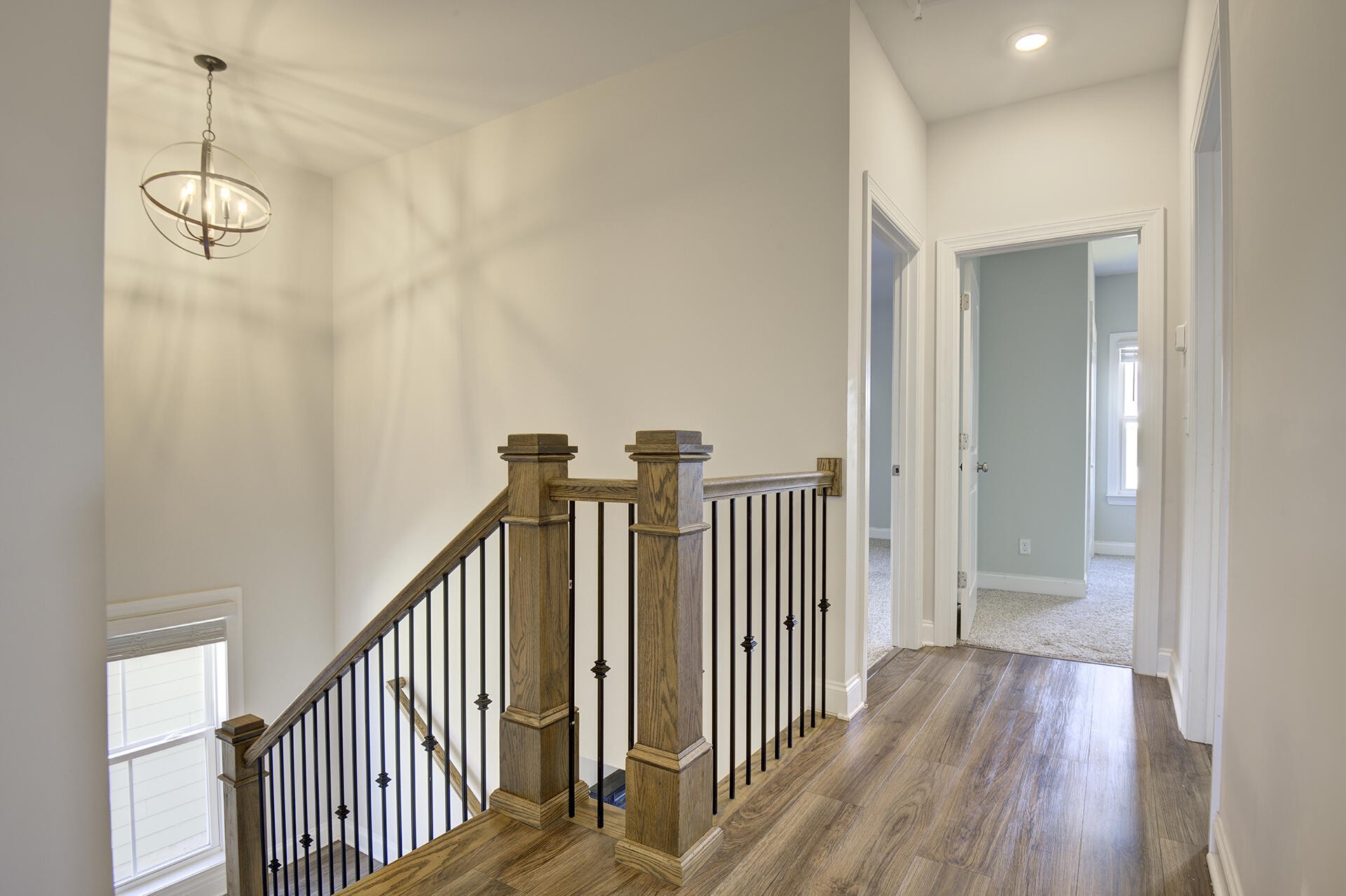 3625 Weathervane Loop Apison, TN 37302 - Photo 35 of 38 a view of a hallway with wooden floor and staircase