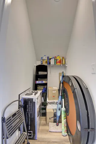 a view of a workspace with furniture and storage