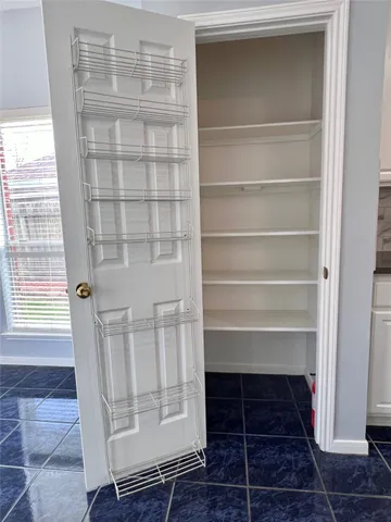 a view of a kitchen with kitchen and stainless steel appliances