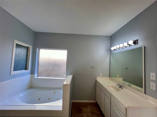 a view of an empty room with a ceiling fan