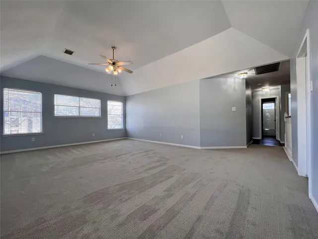 a view of an empty room with a window