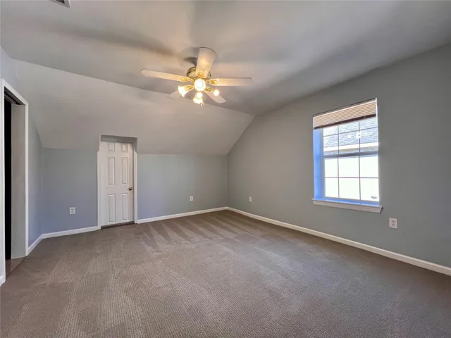 a bathroom with a toilet and a bath tub