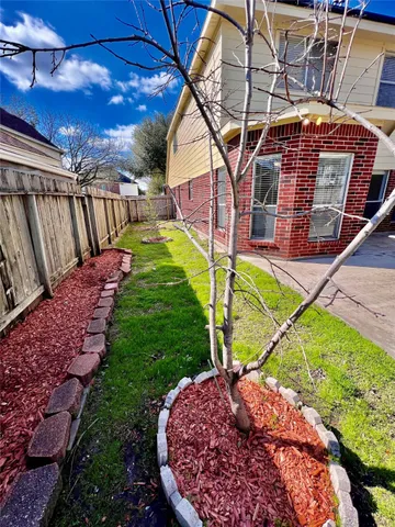 a swimming pool with outdoor seating and yard