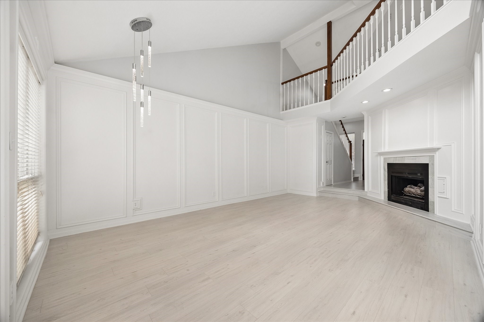 4315 Westheimer Road Houston, TX 77027 - Photo 3 of 15 Open living room with fireplace