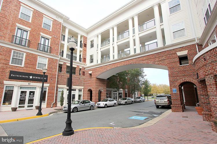 7 Booth Street, Unit 308 Gaithersburg, MD 20878 - Photo 19 of 21 a view of a building with car parked