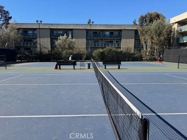 564 North Bellflower Boulevard, Unit 203 Long Beach, CA 90814 - Photo 14 of 20 a view of a patio with couches and table and chairs with wooden floor and fence