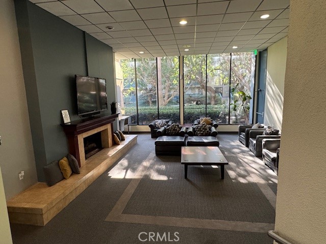 564 North Bellflower Boulevard, Unit 203 Long Beach, CA 90814 - Photo 15 of 20 a room with pool table and glass windows