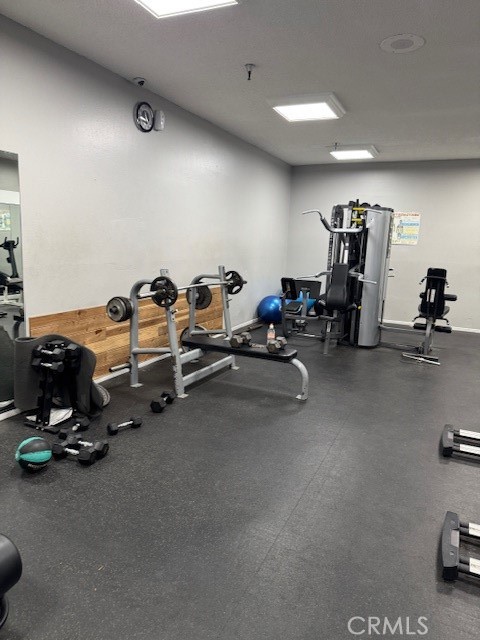 564 North Bellflower Boulevard, Unit 203 Long Beach, CA 90814 - Photo 17 of 20 a room with gym equipment and a table