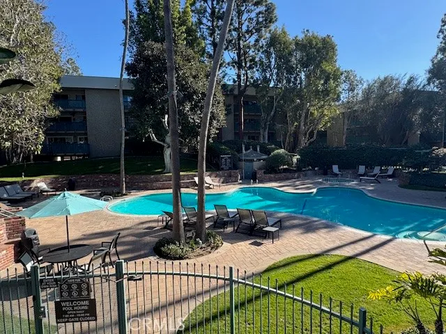 a view of a backyard with sitting area