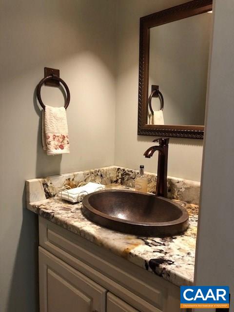 4601 South Blue Ridge Turnpike South Rochelle, VA 22738 - Photo 11 of 20 a bathroom with a sink and a mirror