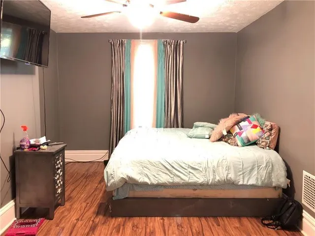 a bedroom with a bed and a table