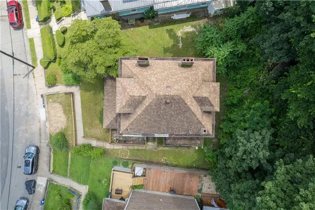 an aerial view of a house with a garden