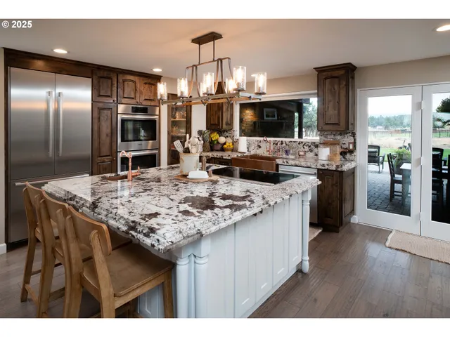 a kitchen with a sink stove and refrigerator