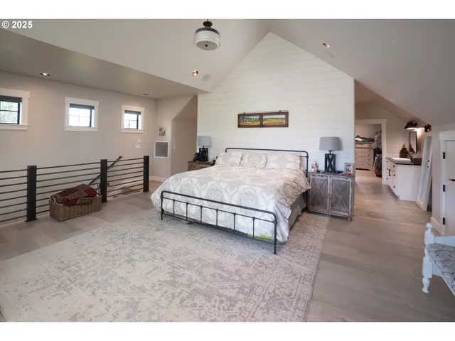 a living room with furniture and a view of kitchen
