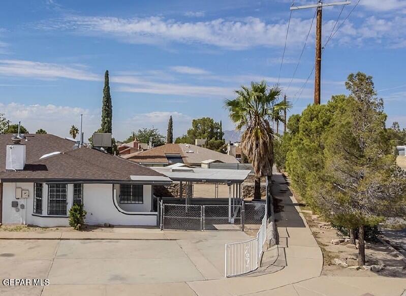 a view of a patio with table and chairs potted plants