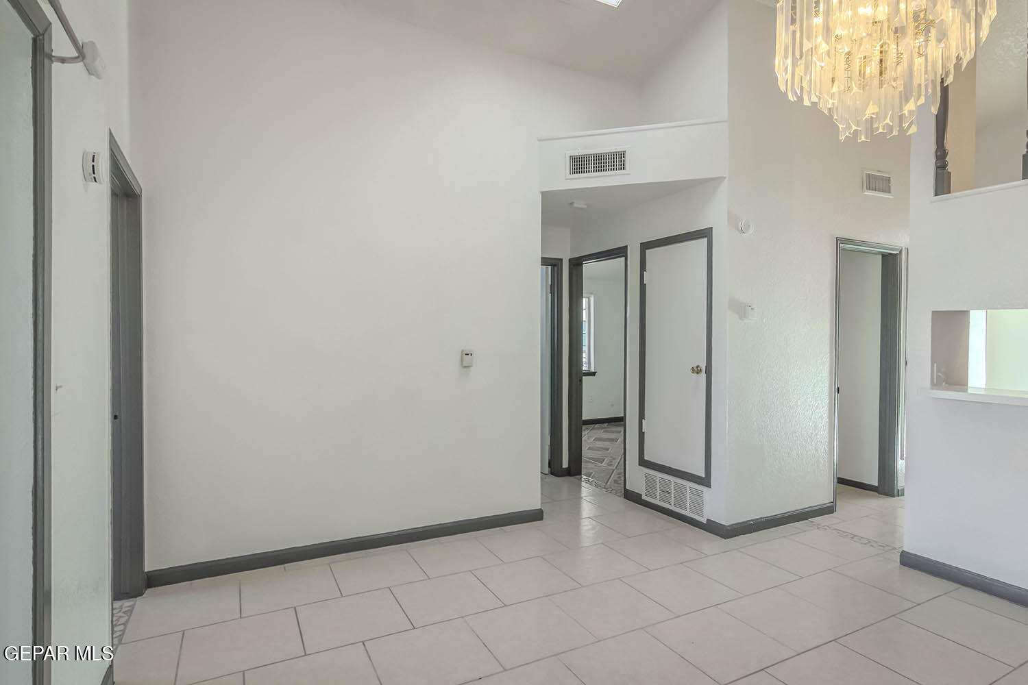 859 Destello Road El Paso, TX 79907 - Photo 15 of 43 a view of a livingroom with wooden floor and a chandelier