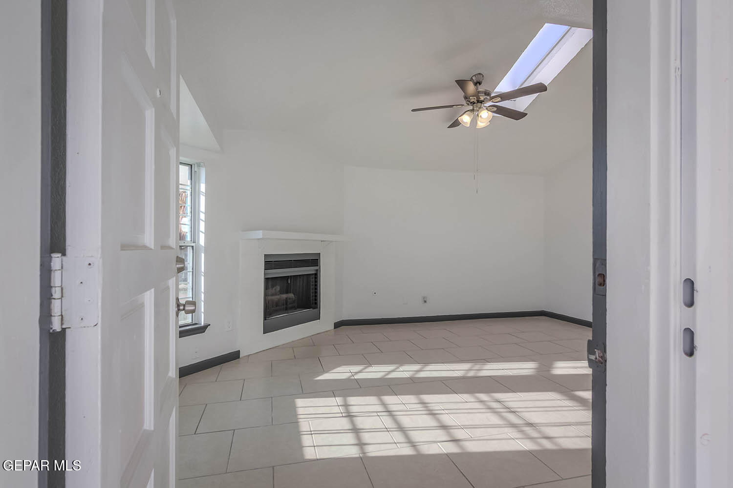 859 Destello Road El Paso, TX 79907 - Photo 2 of 43 a view of a livingroom with a ceiling fan and window