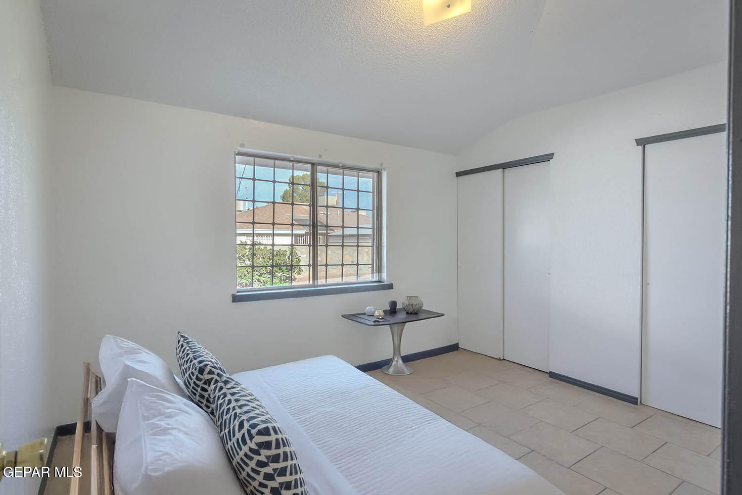 859 Destello Road El Paso, TX 79907 - Photo 25 of 43 a bedroom with a bed and a window