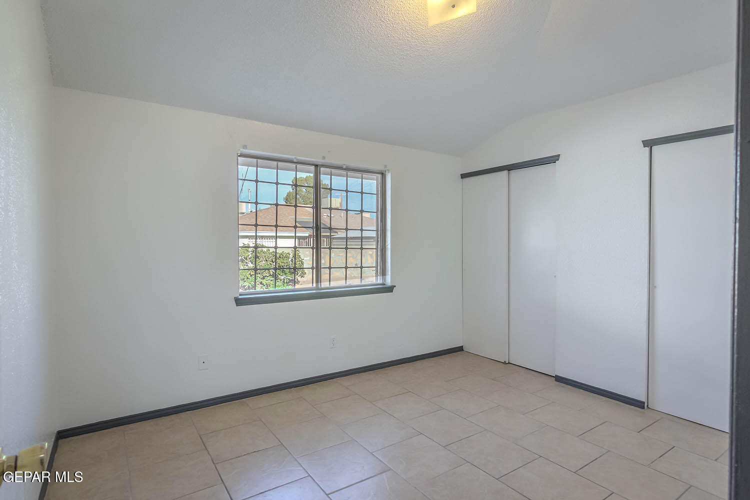 859 Destello Road El Paso, TX 79907 - Photo 31 of 43 a view of an empty room with a window