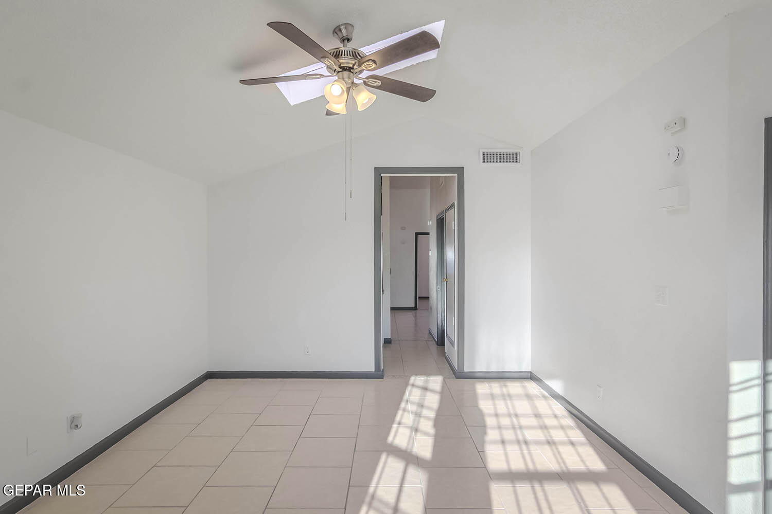 859 Destello Road El Paso, TX 79907 - Photo 9 of 43 a view of a hallway with a chandelier fan and windows