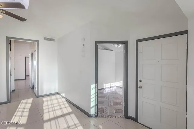 a kitchen with a refrigerator and a sink