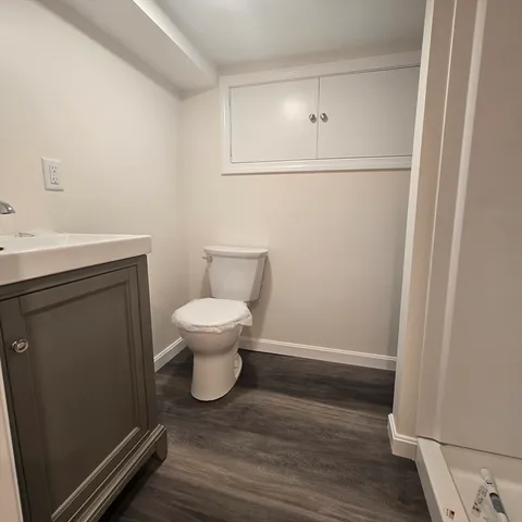 a bathroom with a toilet and a tub