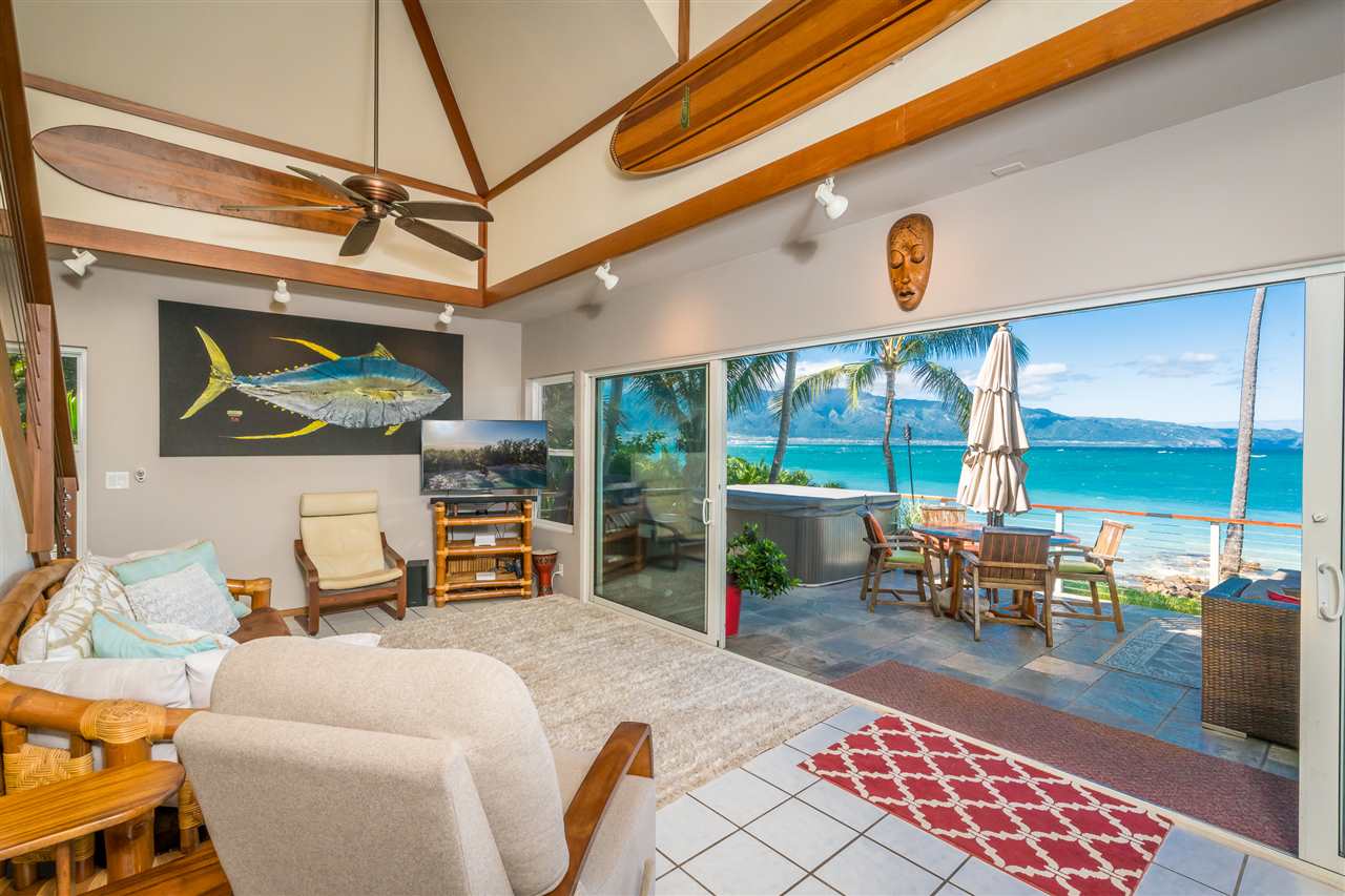 602 Stable Road Paia, HI 96779 - Photo 13 of 30 a dining room with furniture and a floor to ceiling window