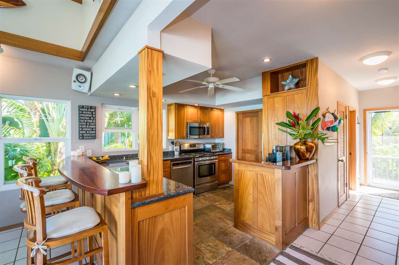 602 Stable Road Paia, HI 96779 - Photo 17 of 30 a dining room with furniture and large windows