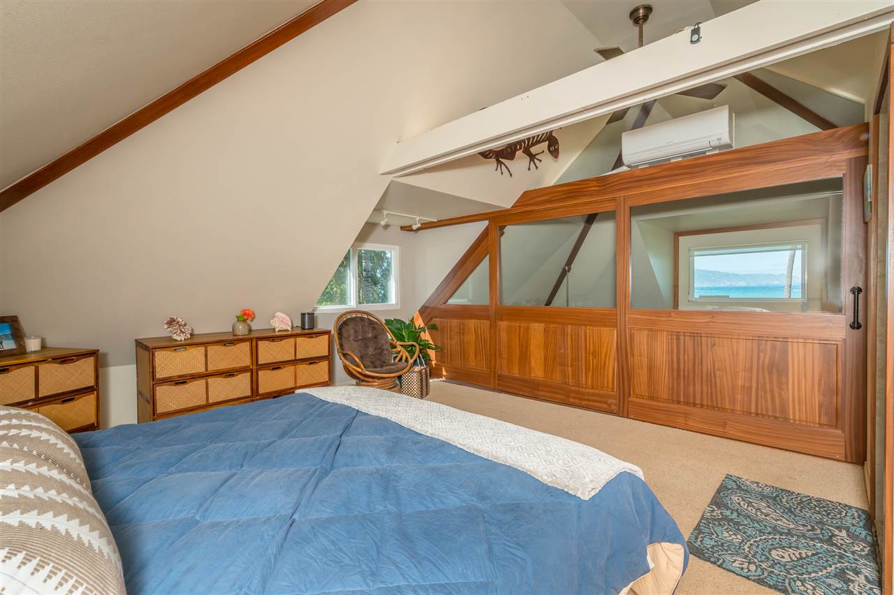 602 Stable Road Paia, HI 96779 - Photo 21 of 30 a bed room with a bed and a window