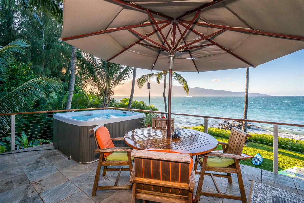 602 Stable Road Paia, HI 96779 - Photo 4 of 30 a view of balcony with chairs and umbrella