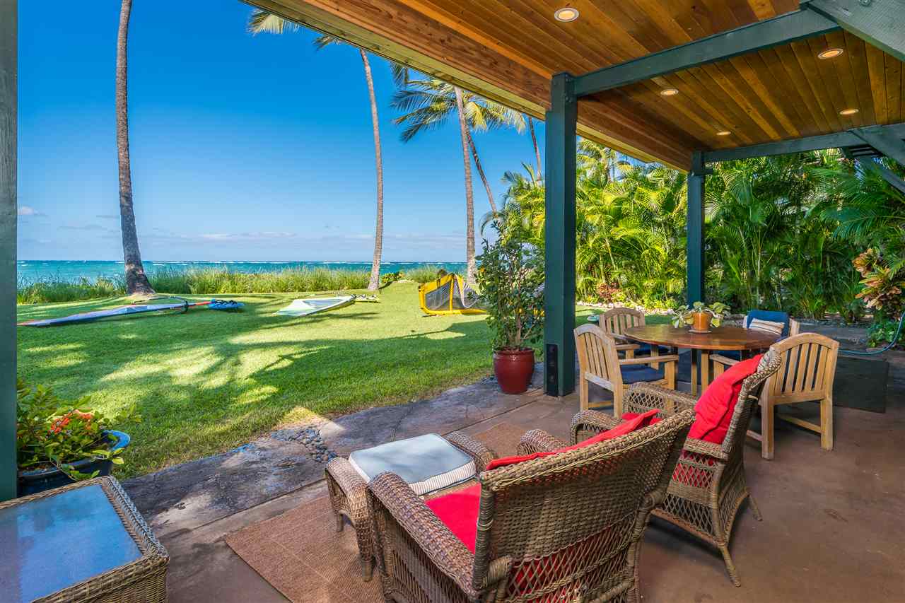 602 Stable Road Paia, HI 96779 - Photo 7 of 30 a view of a patio with a table chairs and a yard