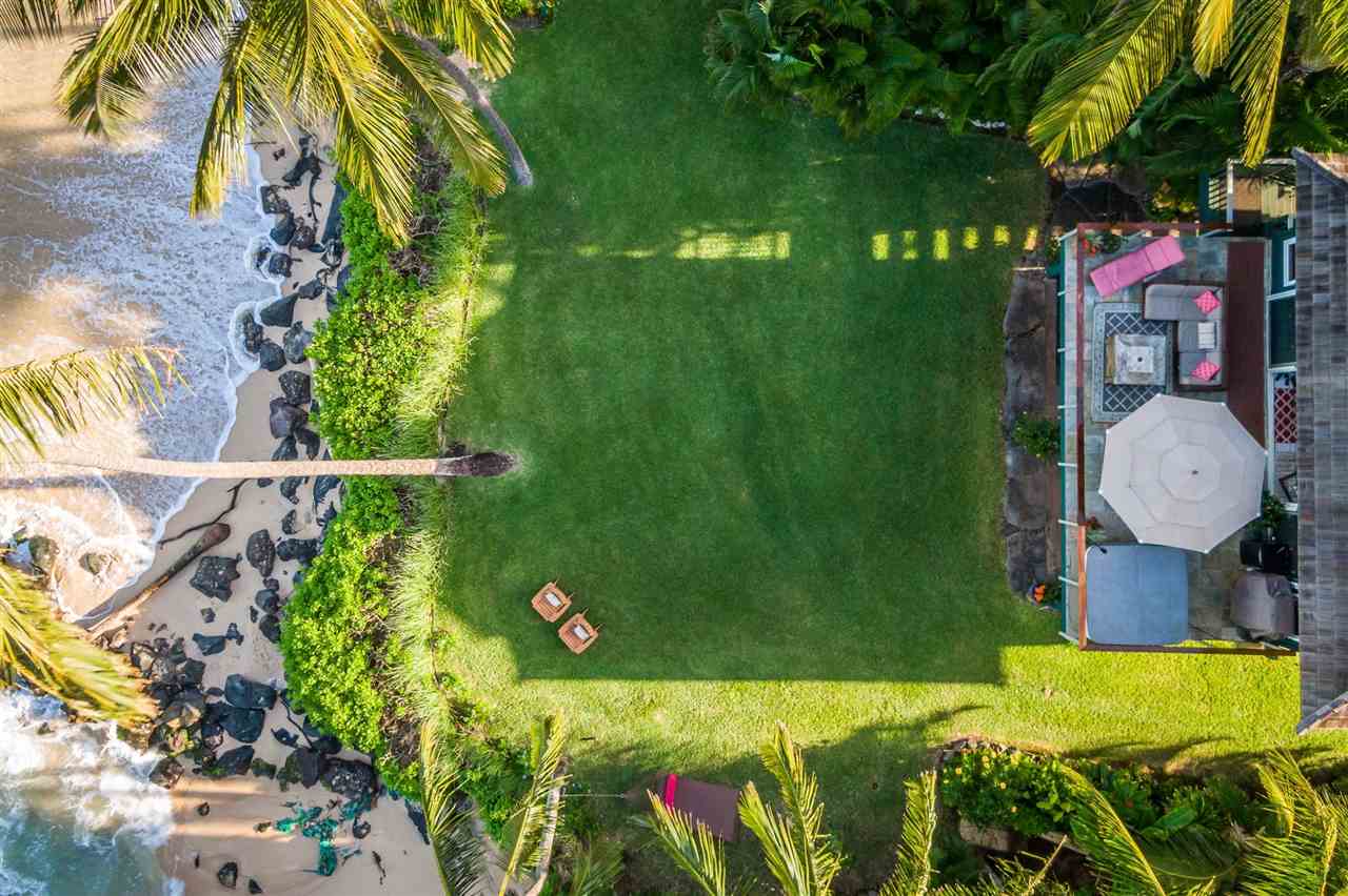 602 Stable Road Paia, HI 96779 - Photo 10 of 30 a backyard of a house with lots of green space