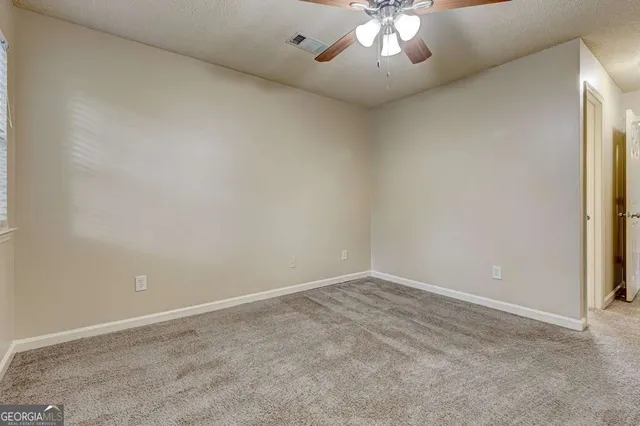 a view of a bathroom from a hallway