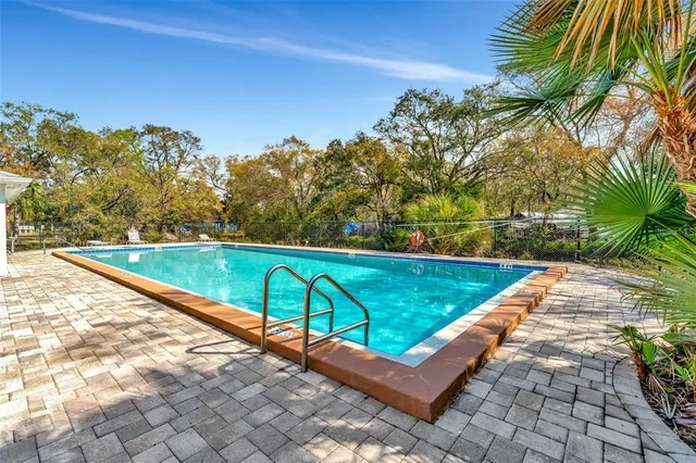 a view of swimming pool with a yard