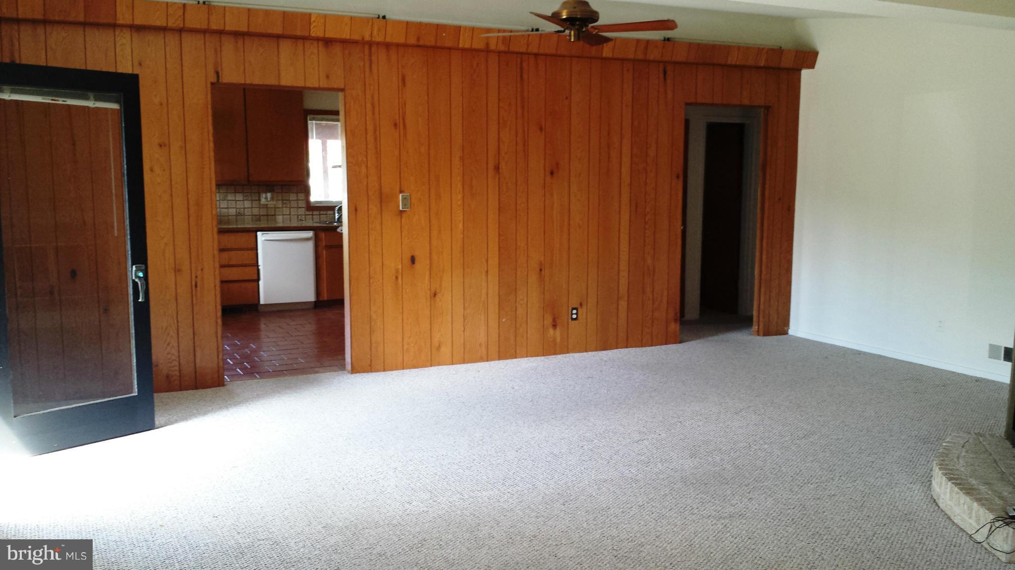 6509 Livingston Road Oxon Hill, MD 20745 - Photo 5 of 30 Living Room w/Berber Carpet & Paneling
