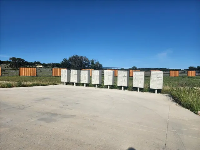 a view of a house with a road