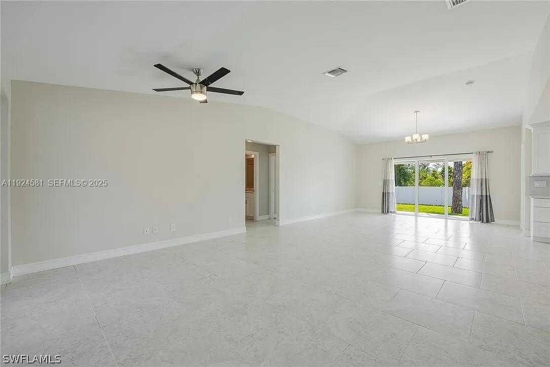 830 Angelo Avenue Lehigh Acres, FL 33971 - Photo 26 of 29 a view of an empty room with a window